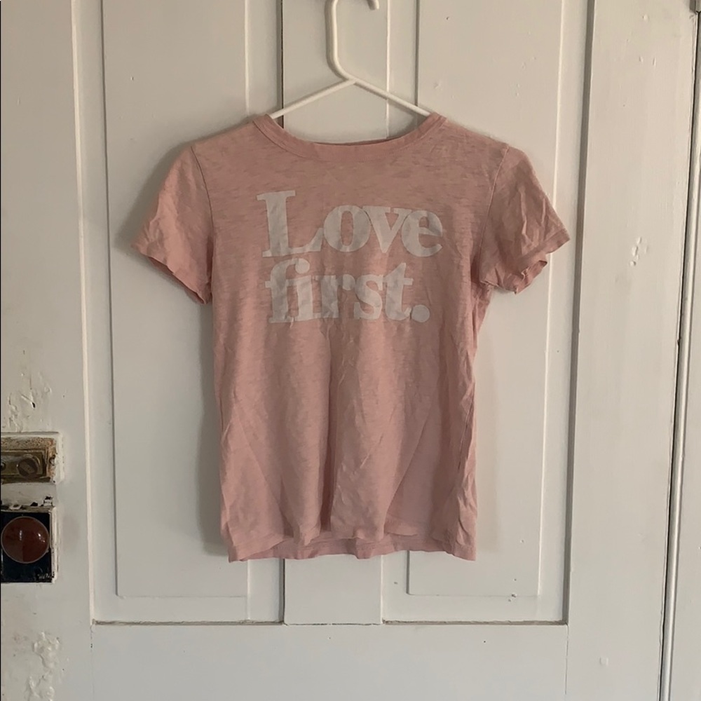 Love First shirt. Women’s size but will fit a kid